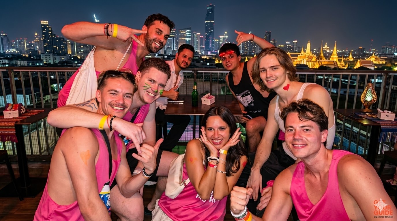 Travellers on a Bangkok rooftop bar with the city skyline behind them